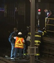 Stranded subway riders in New York had to walk on tracks in order to exit the station following a power outage on August 29.
Mandatory Credit:	WABC