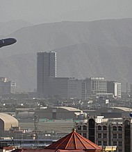 A US Air Force aircraft takes off from the military airport in Kabul on August 27, as the Pentagon said the evacuation of tens of thousands of people from Afghanistan still faces more possible attacks like the bombing that killed scores of people outside the Kabul airport.
Mandatory Credit:	AFP/Getty Images