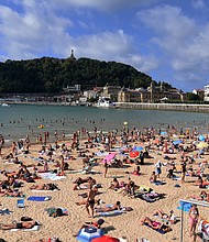 The European Union is expected to recommend on Monday that member states reinstate Covid-related travel restrictions and halt nonessential travel from the United States and five other countries. People are seen here at the Beach of the Concha in San Sebastian Guipuzkoa, Spain, on Tuesday.
Mandatory Credit:	Ramon Costa/SOPA Images/LightRocket/Getty Images