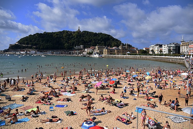 The European Union is expected to recommend on Monday that member states reinstate Covid-related travel restrictions and halt nonessential travel from the United States and five other countries. People are seen here at the Beach of the Concha in San Sebastian Guipuzkoa, Spain, on Tuesday.
Mandatory Credit: Ramon Costa/SOPA Images/LightRocket/Getty Images