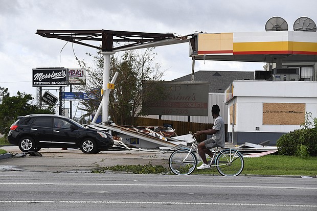 Hurricane Ida's direct hit on the nation's oil and gasoline industry could send gas prices higher. Pictured is damaged Shell station in Kenner, Louisiana, on August 30, after Hurricane Ida made landfall.
Mandatory Credit: Patrick T. Fallon/AFP/Getty Images