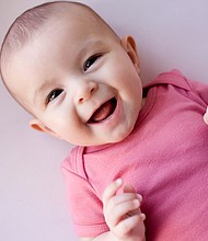 The laughing patterns of human infants match those of great apes, according to a study published in Biology Letters.
Mandatory Credit:	Cecile Lavabre/The Image Bank RF/Getty Images