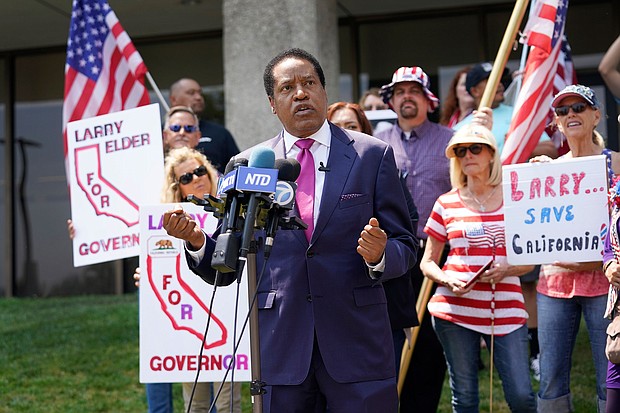 Larry Elder, pictured here on July 13, in California, vying to replace California Gov. Gavin Newsom, vows to repeal any mask or vaccine mandates for California's state workers if he is elected to replace the Democratic governor in the September 14 special election.
Mandatory Credit: Marcio Jose Sanchez/AP