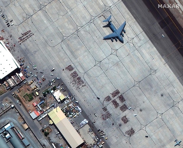 Taliban members escorted Americans who sought to escape Afghanistan to gates at Kabul airport as part of a secret arrangement with the United States. Pictured is Kabul airport on August 23.
Mandatory Credit:	Satellite image ©2021 Maxar Tec/AP