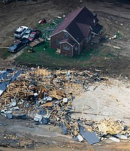 Middle Tennessee, still in recovery mode after last week's deadly and destructive flooding, sits right in tropical storm Ida's crosshairs. Pictured are homes and cars damaged by catastrophic flooding on August 25, in Waverly, Tennessee.
Mandatory Credit:	Mark Humphrey/AP