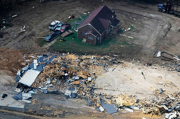 Middle Tennessee, still in recovery mode after last week's deadly and destructive flooding, sits right in tropical storm Ida's crosshairs. Pictured are homes and cars damaged by catastrophic flooding on August 25, in Waverly, Tennessee.
Mandatory Credit: Mark Humphrey/AP
