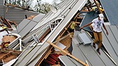 Jeremy Hodges walks Monday onto his family’s storage unit in Houma, La., an area that was devastated by Hurricane Ida that struck Sunday with winds over 150 mph.