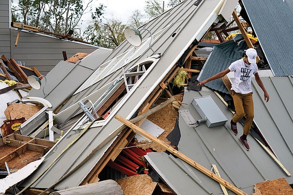 Lights came back on for a fortunate few, some corner stores opened their doors and crews cleared fallen trees and ...