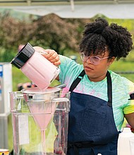Rabia Kamara creates a unique ice cream flavor during the “Ben & Jerry’s: Clash of the Cones” competition. She is in the kitchen-lab on the grounds of the Ben & Jerry’s factory in Waterbury, Vt., where the show was filmed in May.