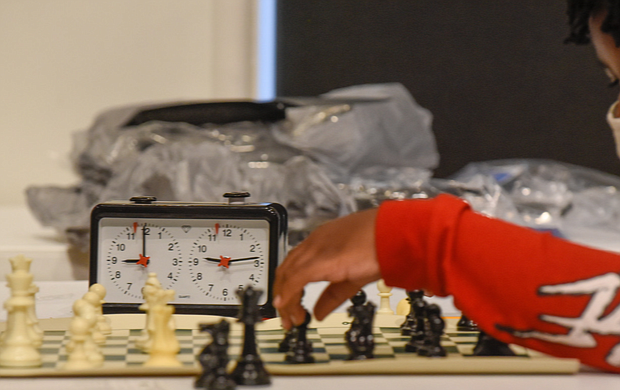 Checkmate! It was a race against the clock – and each other – during the Bright Minds RVA Chess Tournament, where a room full of area students matched wits last Friday, Aug. 27, at the Black History Museum and Cultural Center of Virginia. The tournament was the culmination of two weeks of classes taught by Fleming E. Samuels, a retired Richmond Public Schools administrator, and Dr. Theodore Andrews of Hampton University in a pilot program set up by the Bernice E. Travers Foundation. The inspiring group of 13- to 16-year-olds showed off the skills they learned during the tournament in which 14 students participated. Binford Middle School student Jacory Oliver-Ray, 13, contemplates his next move. Clinching the top three spots and prizes were Denzel Johnson; Jonathan Keel, 15, a student at Richmond Community High School; and Ptah Ahmed. (photo by Clement Britt)