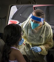 More than 500,000 children tested positive for Covid-19 in 3 weeks. Experts say school mask mandates are needed. Pictured is a drive-thru vaccination and testing site in Austin, Texas, on August 5.
Mandatory Credit:	Matthew Busch/BloombergGetty Images