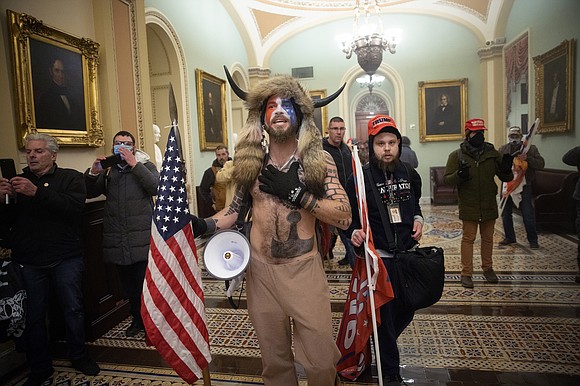 The so-called "QAnon Shaman" who stormed the US Capitol in a horned bearskin outfit pleaded guilty Friday to a felony …