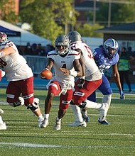 Virginia Union University players work to protect Panthers’ quarterback Khalid Morris on the snap.