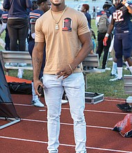 Trenton Cannon, a former VSU standout from Hampton who played with the NFL’s New York Jets in 2018, watches last Saturday’s game from the Trojans’ sidelines. Cannon is now a free agent.
