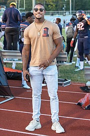 Trenton Cannon, a former VSU standout from Hampton who played with the NFL’s New York Jets in 2018, watches last Saturday’s game from the Trojans’ sidelines. Cannon is now a free agent.