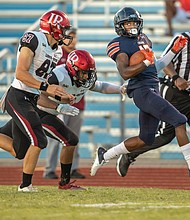 Virginia State University wide receiver Javon LaPierre slips past the Lenoir-Rhyne defense with an 82-yard punt return to the Lenoir-Rhyne 8 yard line during last Saturday’s season opener at Rogers Stadium in Ettrick.