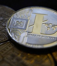 Cryptocurrency litecoin surged around 25% early Monday after a falsified news release said Walmart would begin accepting the payment for online purchases.
Mandatory Credit:	Jakub Porzycki/NurPhoto/Getty Images