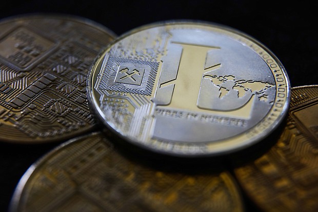Cryptocurrency litecoin surged around 25% early Monday after a falsified news release said Walmart would begin accepting the payment for online purchases.
Mandatory Credit:	Jakub Porzycki/NurPhoto/Getty Images