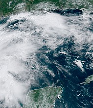This satellite image provided by NOAA shows Tropical Storm Nicholas in the Gulf of Mexico on Sunday, September 12.
Mandatory Credit:	NOAA/AP
