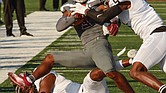 Virginia Union University wide receiver Jaiden Reavis is taken down last Saturday by two players from Valdosta State University, Jaylen Jackson on the ground and Ivory Durham.