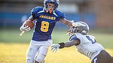 Armstrong High School’s Kile Artis gets past the John Marshall High defense to score a touchdown in last Friday’s game. The Armstrong Wildcats wore jerseys bearing the colors and mascot name – the Jaguars – of the former Armstrong-Kennedy High School Complex.