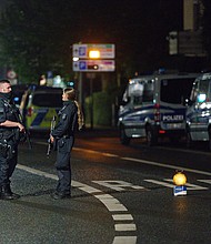 Police officers block a street in Hagen on Wednesday evening after warnings of a terror threat against a synagogue.
Mandatory Credit:	Henning Kaiser/picture alliance/Getty Images