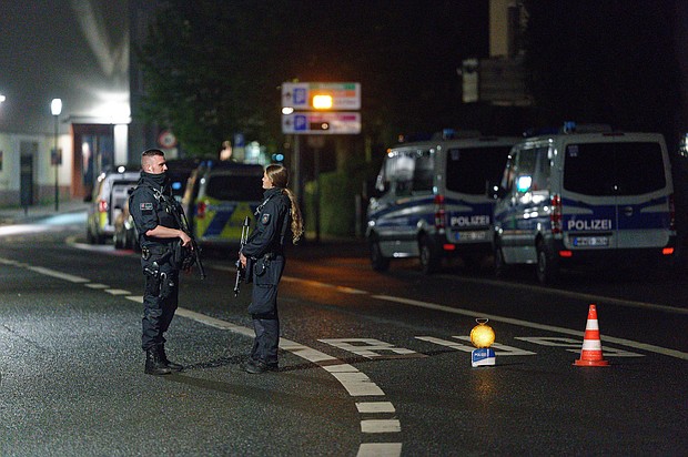 Police officers block a street in Hagen on Wednesday evening after warnings of a terror threat against a synagogue.
Mandatory Credit:	Henning Kaiser/picture alliance/Getty Images