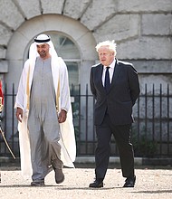 Britain's Prime Minister Boris Johnson and Abu Dhabi Crown Prince Sheikh Mohamed bin Zayed Al Nahyan in London on September 16.
Mandatory Credit:	Hannah Mckay/AP