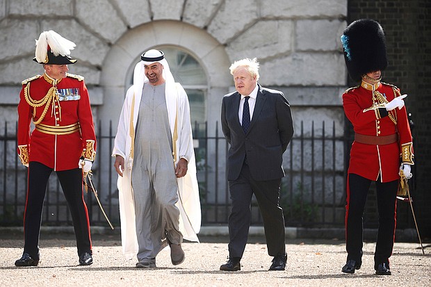 Britain's Prime Minister Boris Johnson and Abu Dhabi Crown Prince Sheikh Mohamed bin Zayed Al Nahyan in London on September 16.
Mandatory Credit:	Hannah Mckay/AP