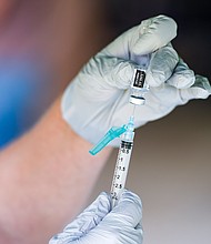 A nurse fills a syringe with a dose of BioNTech, Pfizer Covid-19 vaccine. Four words — "do your own research" — are hurting the US pandemic response, CNN's chief media correspondent Brian Stelter said on "Reliable Sources" September 19.
Mandatory Credit:	Ben Hasty/MediaNews Group/Reading Eagle/Getty Images