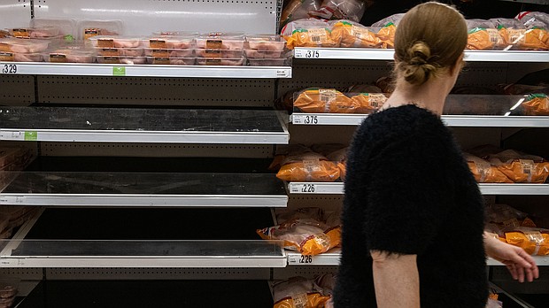 Shelves usually stocked with chicken stand empty at an Asda supermarket on September 19 in London.
Mandatory Credit:	Chris J Ratcliffe/Getty Images