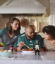 Pepsi launched its “Made for Eagles Watching” campaign with digital content featuring a virtual Jalen Hurts helping one family take their pre-game food prep up a notch, just in time for the coin toss. PRNewsFoto/PepsiCo