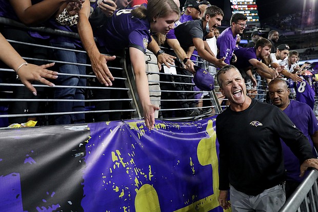 Harbaugh celebrates after defeating the Kansas City Chiefs.
Mandatory Credit:	Todd Olszewski/Getty Images