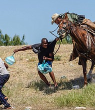 White House press secretary Jen Psaki says that the White House is seeking more information on the "horrific" viral videos that appear to show US Border Patrol agents on horseback confronting Haitian refugees at the US border.
Mandatory Credit:	Paul Ratje/AFP/Getty Images