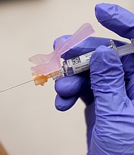 Susana Sanchez, a Nurse Practitioner, administers a flu vaccination to Loisy Barrera at a CVS pharmacy and MinuteClinic on Sept. 10 in Miami, Florida. CVS Health is offering the flu shots by appointment or walking in as health experts encourage people to get their flu shots in hopes of preventing a bad flu season.
Mandatory Credit:	Joe Raedle/Getty Images