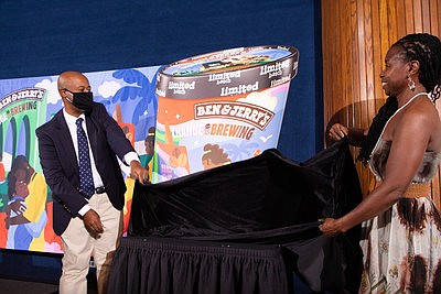 Jabari Paul of Ben & Jerry's and Monifa Bandele of Movement 4 Black Lives unveil Ben & Jerry's newest flavor.