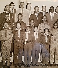 This 1958 photo shows members of the Ebenezer Baptist Church Boy Scout Troop 478 with scout and church officials. J. Maurice Hopkins, front row, third from right, was 11 at the time. He notes that he was wearing a Cub Scout uniform because he was too short to have a Boy Scout uniform in his size until sometime later. William “Bunny” Roane, age 13, is in the front row, second from left. Scoutmaster Linwood D. Ross is in the back row, third from right.