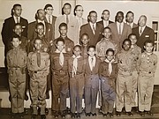 This 1958 photo shows members of the Ebenezer Baptist Church Boy Scout Troop 478 with scout and church officials. J. Maurice Hopkins, front row, third from right, was 11 at the time. He notes that he was wearing a Cub Scout uniform because he was too short to have a Boy Scout uniform in his size until sometime later. William “Bunny” Roane, age 13, is in the front row, second from left. Scoutmaster Linwood D. Ross is in the back row, third from right.