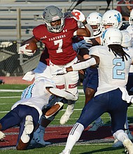 Virginia Union University running back Jada Byers is swarmed by Virginia University of Lynchburg’s defense last Saturday at Hovey Stadium. The freshman from New Jersey rushed for a total of 201 yards and two touchdowns during the game.