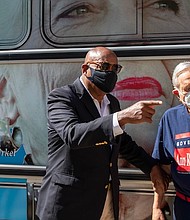 Harris County Commissioner Rodney Ellis, left, and Arthur L. Schechter, former U.S. Ambassador to the Commonwealth of The Bahamas, talk on side of the Gov. Ann Richards bus after a news conference announcing the Ann Banners art project on Thursday.