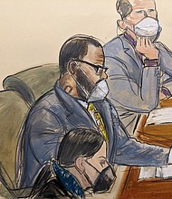 In this courtroom sketch, R. Kelly, center, sits with his defense attorneys Thomas Farinella, top, and Nicole Blank Becker during the first day of his defense in his sex trafficking case, Monday, September 20 in New York.
Mandatory Credit:	Elizabeth Williams/AP