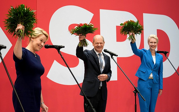 From left, Franziska Giffey, top candidate of the SPD for Mayor of the German city of Berlin, Olaf Scholz, top candidate for chancellor of the Social Democratic Party (SPD), and Manuela Schwesig, member of the SPD and governor of the German state of Mecklenburg-Western Pomerania.
Mandatory Credit:	Michael Sohn/AP