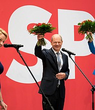 From left, Franziska Giffey, top candidate of the SPD for Mayor of the German city of Berlin, Olaf Scholz, top candidate for chancellor of the Social Democratic Party (SPD), and Manuela Schwesig, member of the SPD and governor of the German state of Mecklenburg-Western Pomerania.
Mandatory Credit:	Michael Sohn/AP