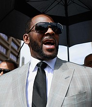 In this file photo, R. Kelly leaves the Leighton Criminal Court building in Chicago on June 6, 2019. Accusers and others demanding accountability for the R&B superstar over allegations that he was abusing young women and girls for decades say it took so long to get to a guilty verdict in part because his targets were Black. R. Kelly was convicted Monday, Sept. 27, 2021, in his sex trafficking trial in federal court in New York.