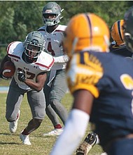 Virginia Union University running back Kore Prentice-Cole, a freshman from Fayetteville, N.C., carries the ball right up the center during last Saturday’s game against Johnson C. Smith University. The Panthers defeated the Golden Bulls 43-7 on their home turf in Raleigh, N.C.