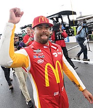 Bubba Wallace celebrates after winning the NASCAR Cup Series auto race Monday in Talladega, Ala., where he led the pack before a rain delay.