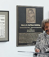 Mary DePillars, widow of VCUarts dean Dr. Murry N. DePillars, speaks at the dedication ceremony Sept. 30 renaming the arts building at 1000 W. Broad St. in honor of her late husband. A plaque honoring Dr. DePillars, along with copies of two of his art pieces, are behind her in the building’s lobby.