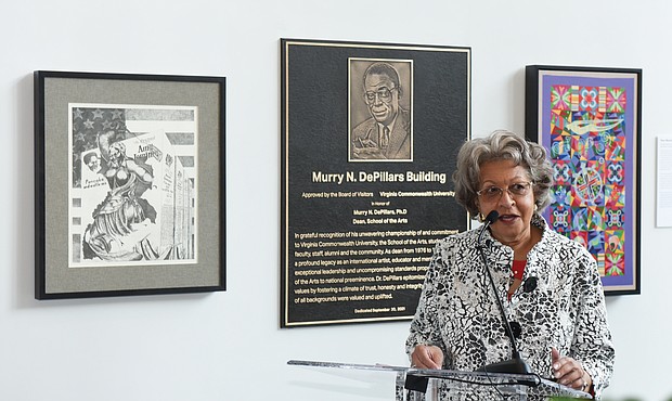 Mary DePillars, widow of VCUarts dean Dr. Murry N. DePillars, speaks at the dedication ceremony Sept. 30 renaming the arts building at 1000 W. Broad St. in honor of her late husband. A plaque honoring Dr. DePillars, along with copies of two of his art pieces, are behind her in the building’s lobby.
