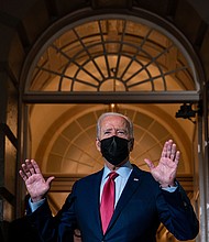 President Joe Biden leaves a House Democratic Caucus