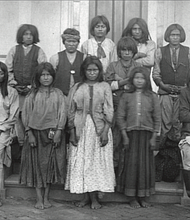 Chiricahua Apache boys and girls pose outdoors at the Carlisle Indian Industrial School in Carlisle, Penn., after their arrival from Fort Marion, Fla., in November 1886.